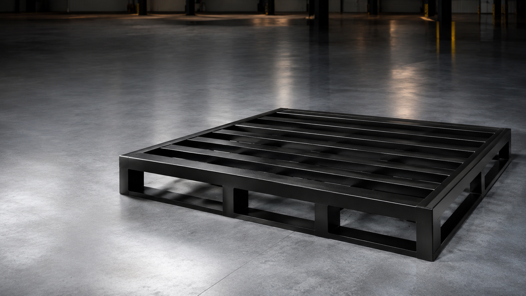 Black fabricated metal pallet in warehouse environment